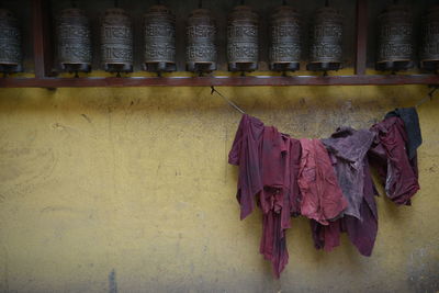 Fabrics hanging by prayer wheels