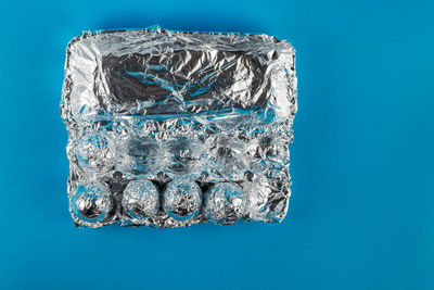 Close-up of ice cubes against blue background