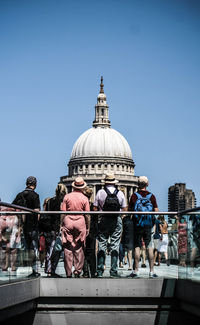 People in front of st paul cathedral against clear sky