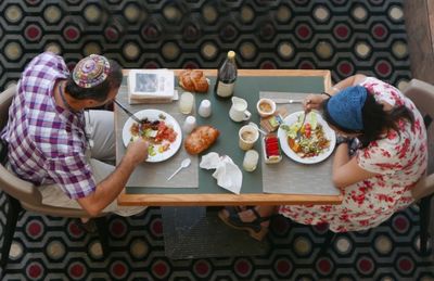 High angle view of couple having food at table