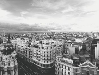 Buildings in city against sky