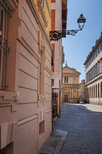 Street in parma and in the background the deconsecrated renaissance church of san marcellino, italy.