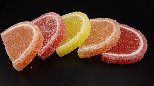 Close-up of cake against black background