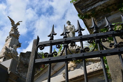 Low angle view of statue against sky