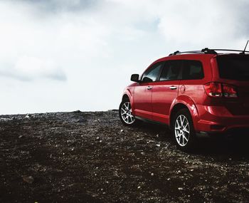 Red car against sky