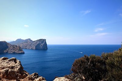 Scenic view of sea against blue sky