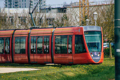 Train on railroad track in city