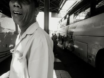 Man standing by train