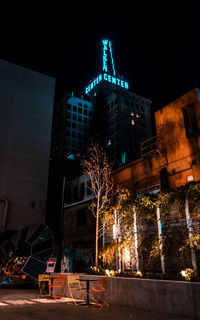 Low angle view of illuminated buildings at night