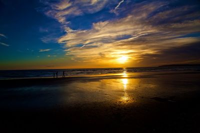 Scenic view of sea against sky at sunset