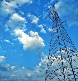 Low angle view of electricity pylon against sky