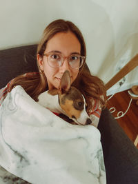 Portrait of young woman with dog