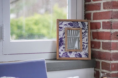 Close-up of window on wall of house