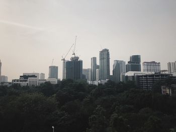 Buildings in city against sky