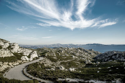 Scenic view of mountains against cloudy sky