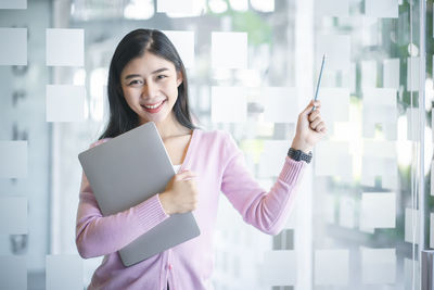 Portrait of a smiling young woman