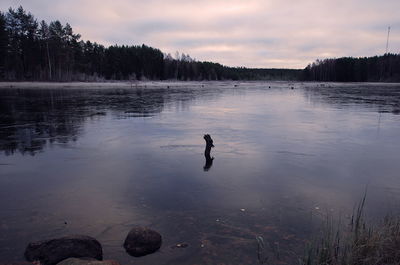 Scenic view of lake against sky during sunset