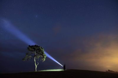 Scenic view of field against sky at night