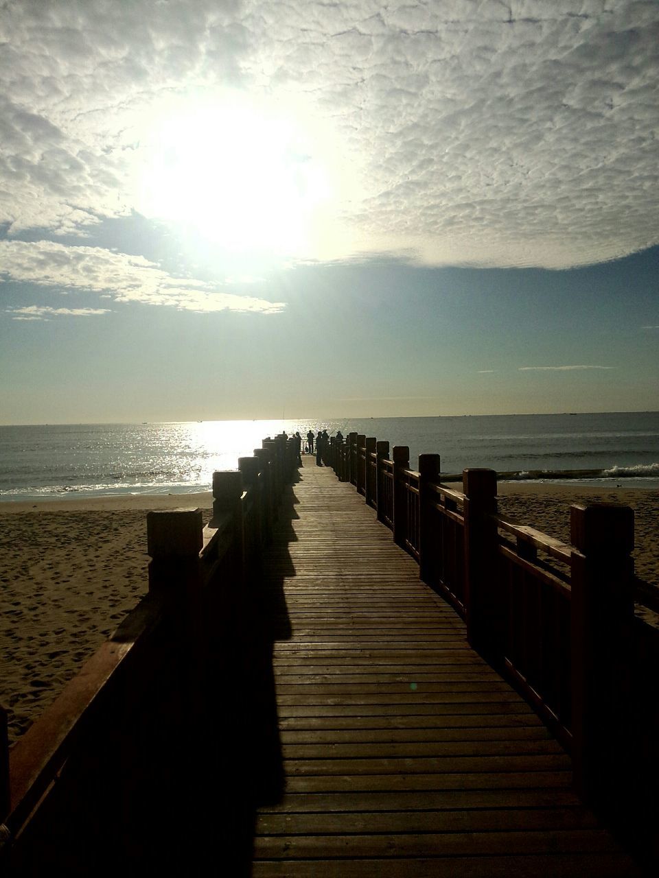 sea, horizon over water, water, sky, pier, tranquil scene, scenics, tranquility, beach, the way forward, beauty in nature, wood - material, nature, sunset, boardwalk, sun, sunlight, idyllic, shore, railing