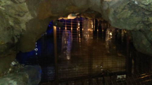 Reflection of illuminated building in cave