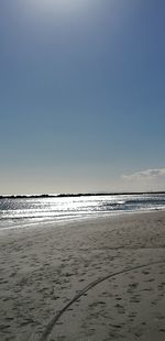 Scenic view of beach against clear sky