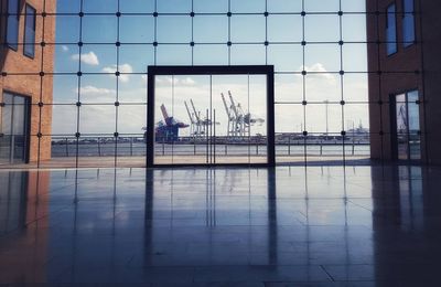 Reflection of building on glass window