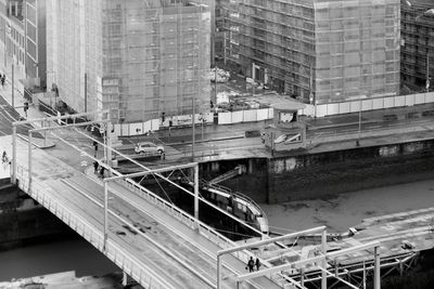 High angle view of railroad tracks amidst buildings in city