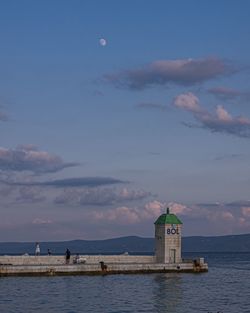 Scenic view of sea against sky at dusk