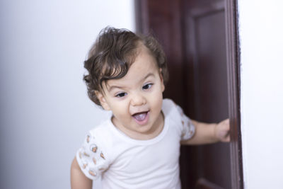 Portrait of cute baby at home