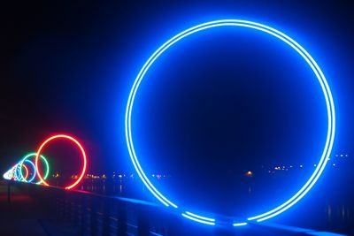 Low angle view of light trails at night