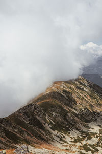 Scenic view of volcanic mountain against sky