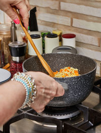 Cropped hand preparing food