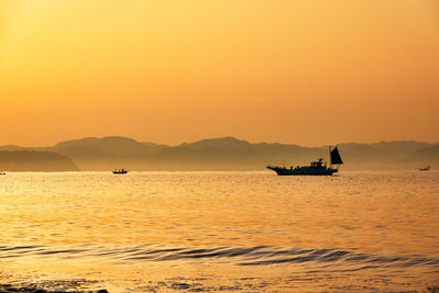 Scenic view of sea against sky during sunrise