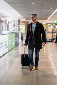 Full length portrait of a man walking on floor