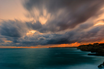 Long exposure of the sea against the cloudy sky during sunset in the mediterranean sea. 