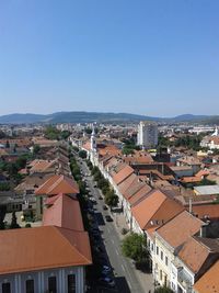 High angle view of townscape against clear blue sky