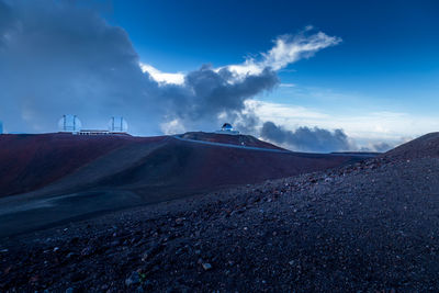 Scenic view of landscape against blue sky