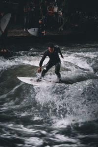 Full length of man surfing in sea