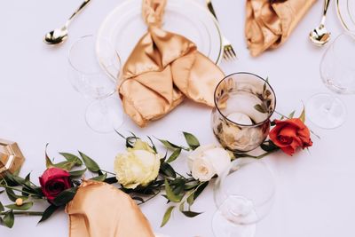 High angle view of roses in vase on table