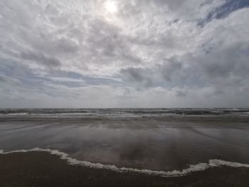 Scenic view of beach against sky