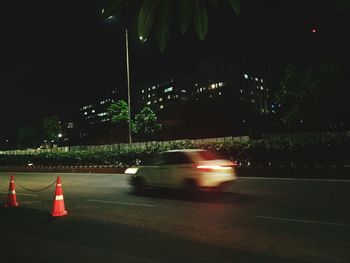 Blurred motion of illuminated street at night