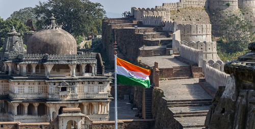 Indian tricolor waving at ancient fort from flat angle