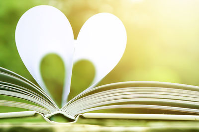 Close-up of heart shape on book