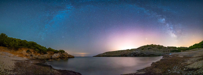 Scenic view of lake against star field