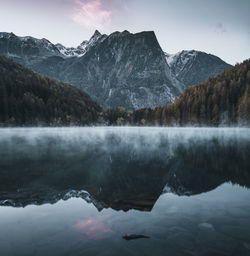 Scenic view of lake and mountains against sky