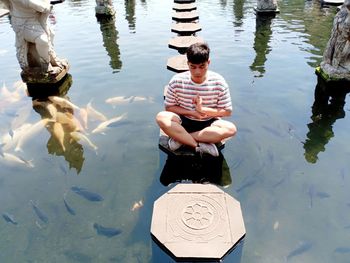 High angle view of boy in lake