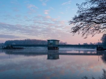 Scenic view of lake against sky during sunset