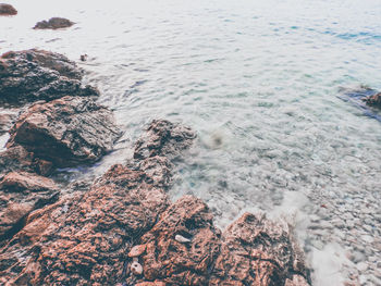 High angle view of rocks in sea