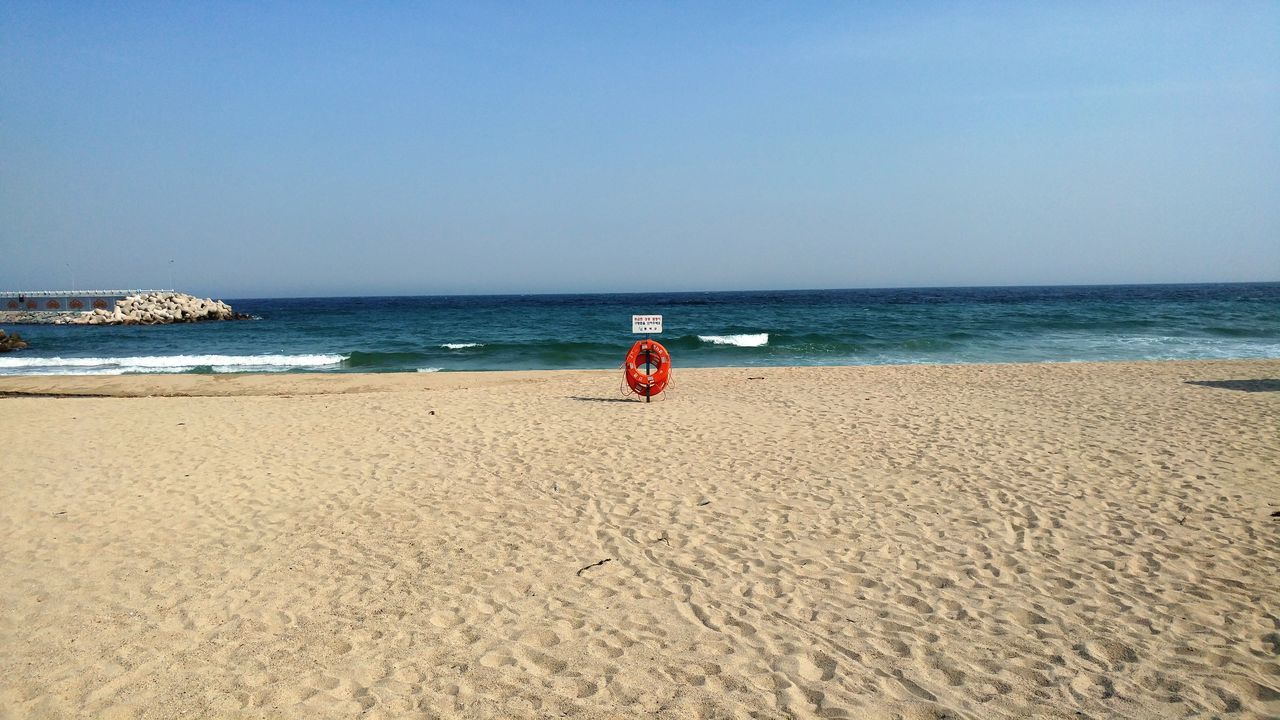 sea, beach, horizon over water, water, shore, sand, clear sky, copy space, tranquility, tranquil scene, scenics, beauty in nature, nature, vacations, transportation, blue, nautical vessel, sky, leisure activity