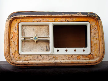 Close-up of old abandoned equipment on table